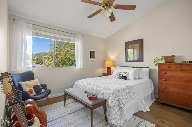28802 Raintree Ln, Saugus, CA 91390 - bedroom with wood finished floors, vaulted ceiling, and ceiling fan