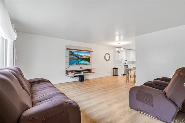 10784 N Magnolia Dr Unit H8, Santee, CA 92071 - living room with light wood-style flooring and a chandelier