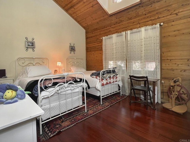 4822 Belvedere Dr, Julian, CA 92036 - bedroom featuring wooden walls, wood finished floors, high vaulted ceiling, and a skylight
