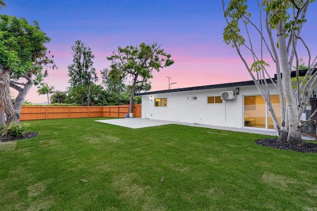 709 Puebla St, Encinitas, CA 92024 - back of house at dusk with a patio, a wall mounted air conditioner, and stucco siding