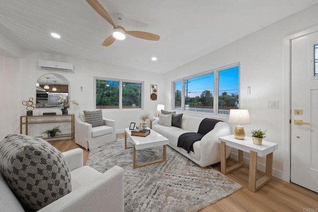 709 Puebla St, Encinitas, CA 92024 - living area with a wall unit AC, wood finished floors, a ceiling fan, and recessed lighting