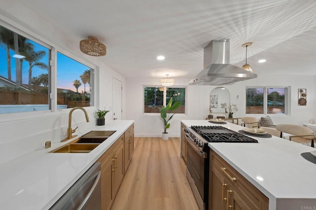 709 Puebla St, Encinitas, CA 92024 - kitchen with wall chimney range hood, appliances with stainless steel finishes, light wood-type flooring, pendant lighting, and recessed lighting