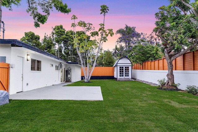 709 Puebla St, Encinitas, CA 92024 - fenced backyard featuring a patio and an outbuilding