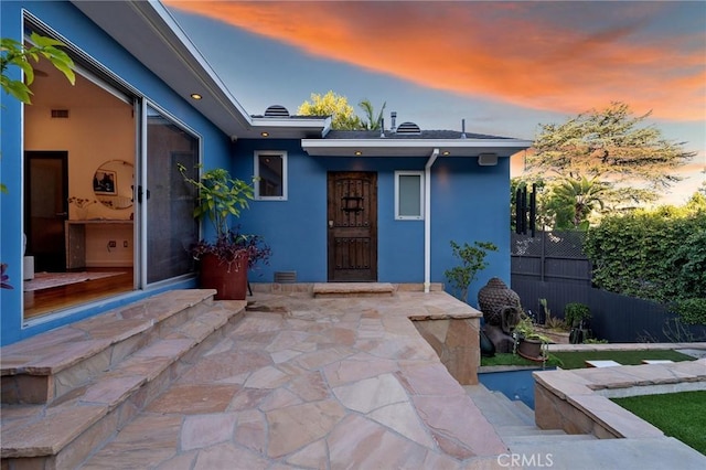 2531 N Commonwealth Ave, Los Angeles, CA 90027 - exterior entry at dusk featuring stucco siding