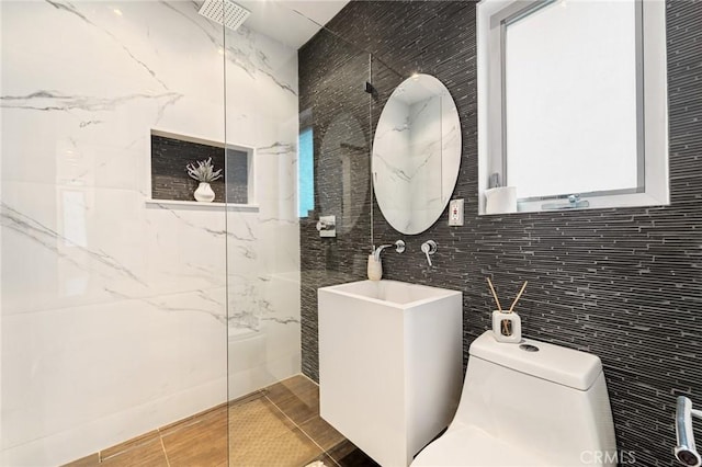 2531 N Commonwealth Ave, Los Angeles, CA 90027 - bathroom featuring tile walls and a marble finish shower
