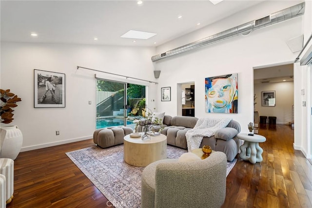 2531 N Commonwealth Ave, Los Angeles, CA 90027 - living room with a skylight, high vaulted ceiling, wood finished floors, and recessed lighting