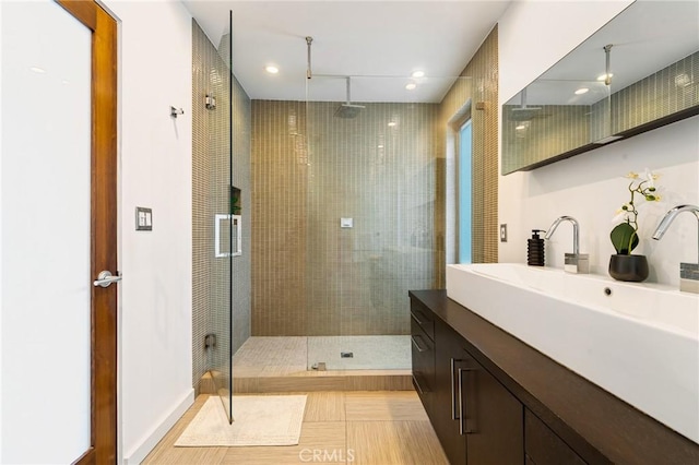 2531 N Commonwealth Ave, Los Angeles, CA 90027 - bathroom featuring a stall shower, vanity, and recessed lighting
