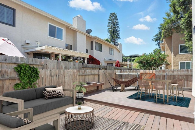 8373 Suntree Pl, San Diego, CA 92119 - deck with an outdoor living space, a fenced backyard, and outdoor dining area