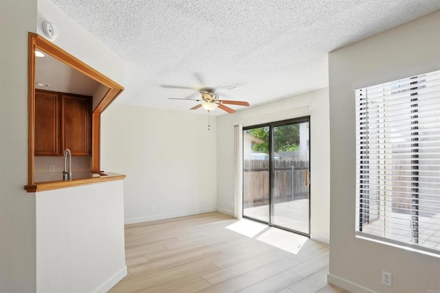 8373 Suntree Pl, San Diego, CA 92119 - spare room with a ceiling fan, a textured ceiling, light wood-type flooring, and a smoke detector