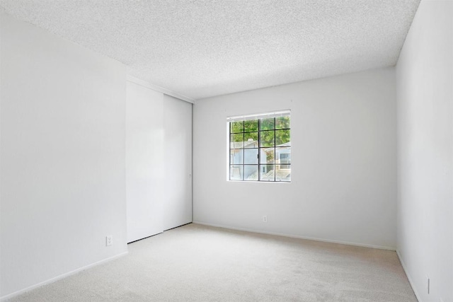 8373 Suntree Pl, San Diego, CA 92119 - empty room featuring light colored carpet and a textured ceiling