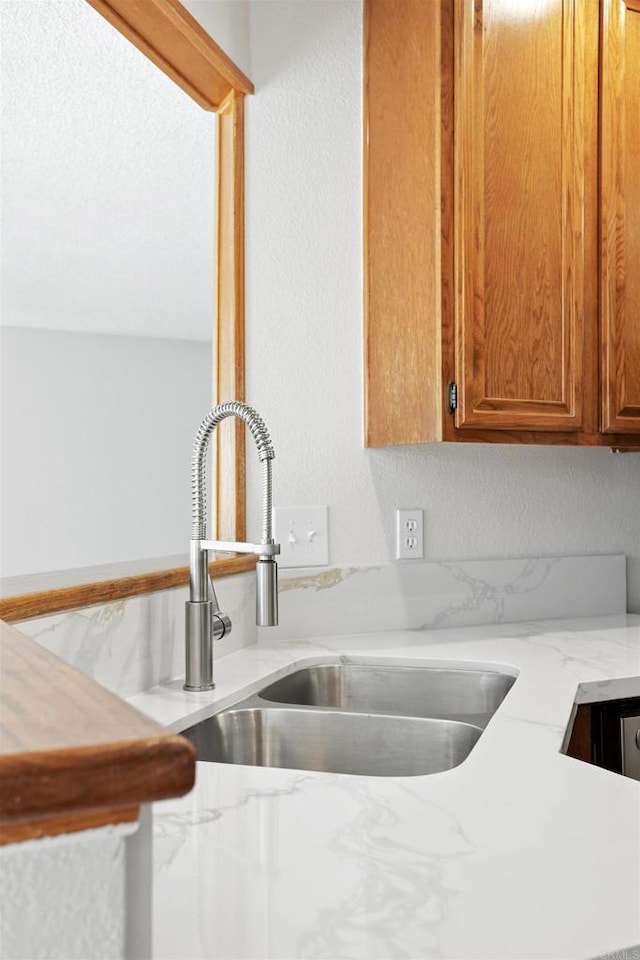 8373 Suntree Pl, San Diego, CA 92119 - kitchen featuring brown cabinetry and light stone counters
