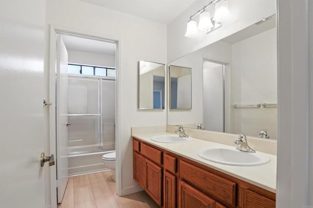 8373 Suntree Pl, San Diego, CA 92119 - bathroom featuring double vanity and shower / bath combination with glass door