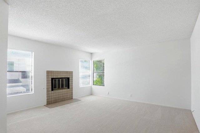 8373 Suntree Pl, San Diego, CA 92119 - unfurnished living room with carpet, a textured ceiling, and a fireplace