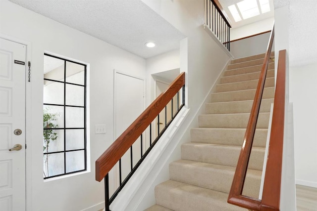 8373 Suntree Pl, San Diego, CA 92119 - stairway with a textured ceiling and recessed lighting