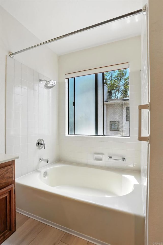 8373 Suntree Pl, San Diego, CA 92119 - bathroom with wood finished floors, vanity, and tub / shower combination