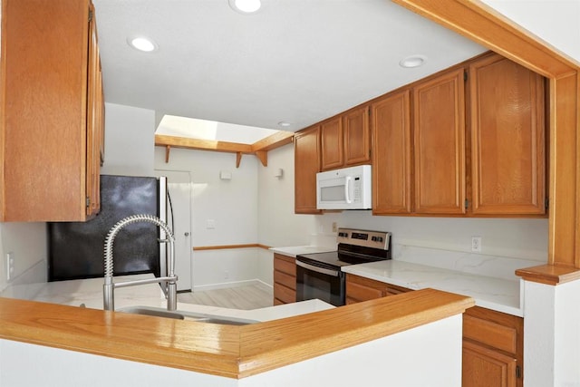 8373 Suntree Pl, San Diego, CA 92119 - kitchen featuring white microwave, stainless steel electric range oven, fridge, light countertops, and recessed lighting