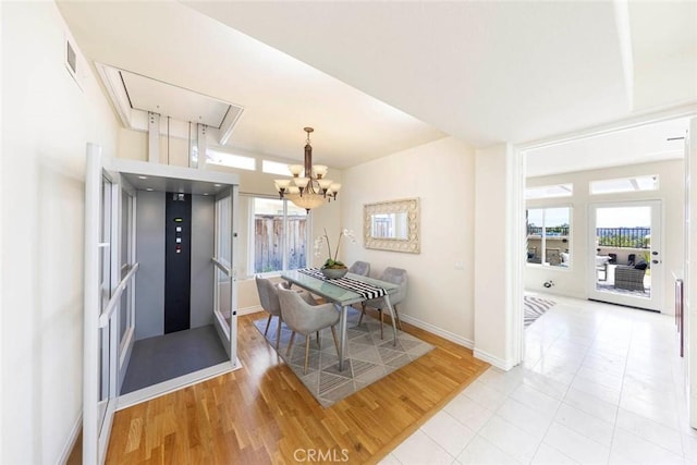 4 Narbonne, Laguna Niguel, CA 92677 - dining area featuring a chandelier, light wood-type flooring, and attic access