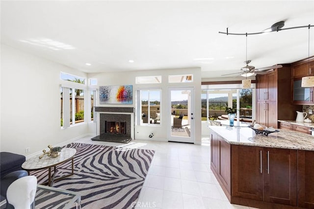 4 Narbonne, Laguna Niguel, CA 92677 - living area with plenty of natural light, light tile patterned floors, a glass covered fireplace, recessed lighting, and a ceiling fan