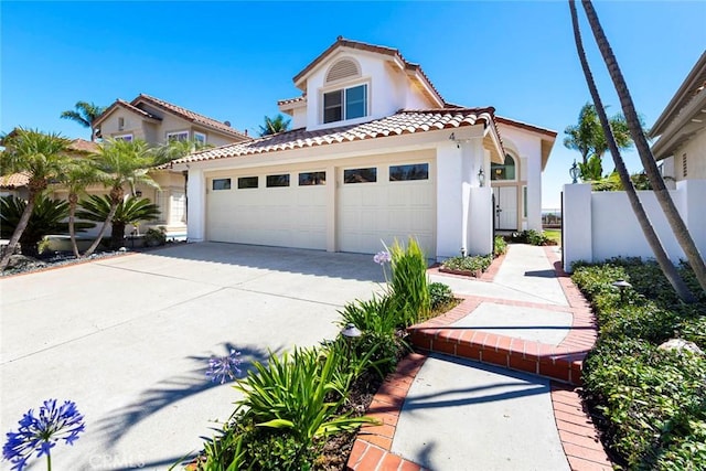 4 Narbonne, Laguna Niguel, CA 92677 - mediterranean / spanish home with stucco siding, a tile roof, driveway, and an attached garage