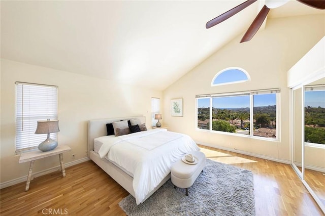 4 Narbonne, Laguna Niguel, CA 92677 - bedroom featuring wood finished floors, high vaulted ceiling, multiple windows, and a ceiling fan