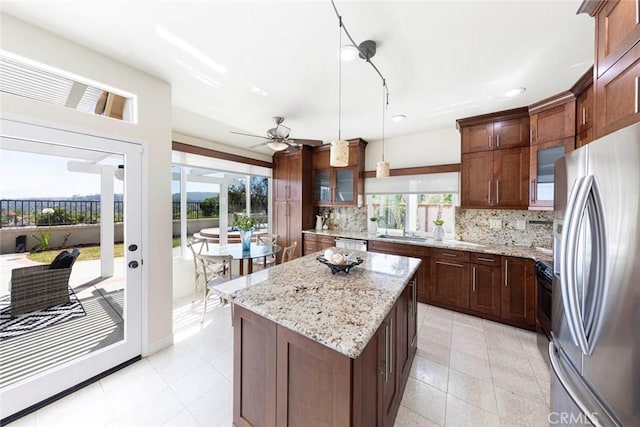 4 Narbonne, Laguna Niguel, CA 92677 - kitchen featuring stainless steel appliances, decorative backsplash, a ceiling fan, a kitchen island, and recessed lighting