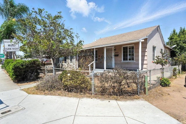 1465 S 43rd St, San Diego, CA 92113 - view of front of property featuring a fenced front yard and covered porch