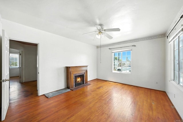 1465 S 43rd St, San Diego, CA 92113 - unfurnished living room with wood finished floors, healthy amount of natural light, and ceiling fan