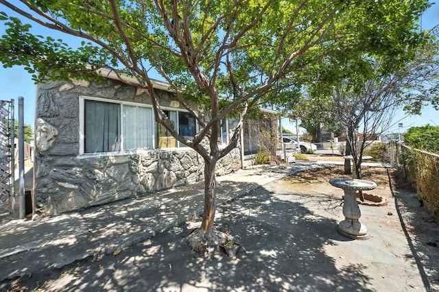 1465 S 43rd St, San Diego, CA 92113 - view of front of house with a patio area and stone siding