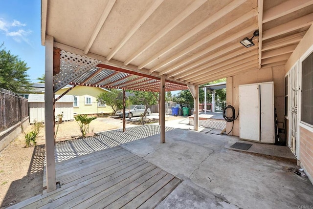 1465 S 43rd St, San Diego, CA 92113 - wooden deck featuring a storage unit and a patio