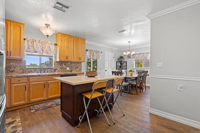 4624 Katherine Place, La Mesa, CA 91942 - kitchen with backsplash, dark wood-type flooring, a chandelier, healthy amount of natural light, and ornamental molding