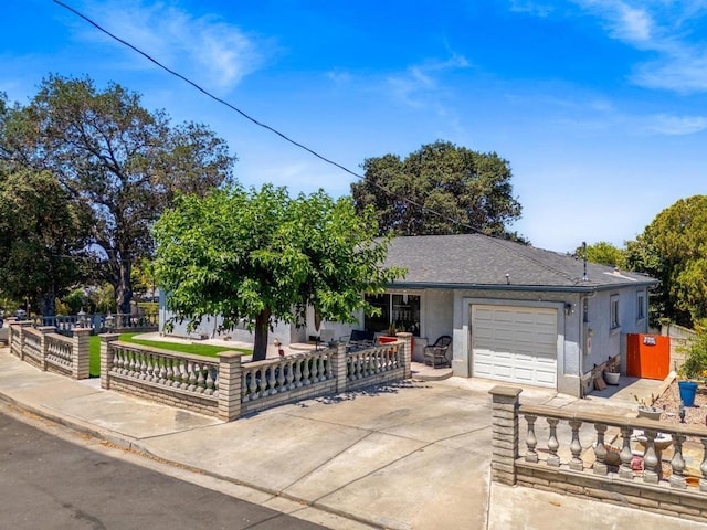 4624 Katherine Place, La Mesa, CA 91942 - view of front facade featuring an attached garage, concrete driveway, a fenced front yard, stucco siding, and a shingled roof