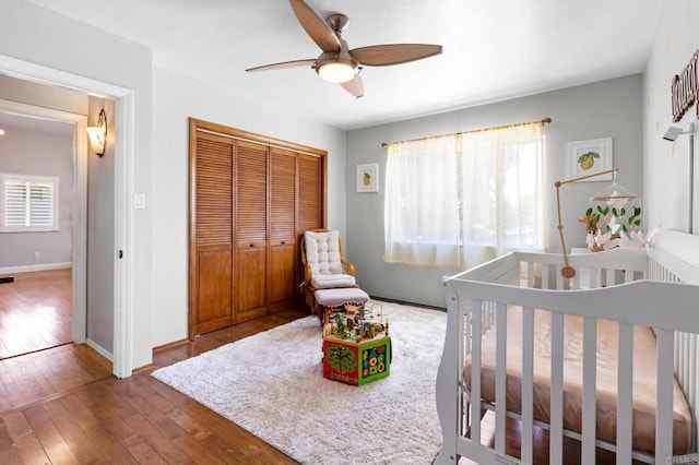 4624 Katherine Place, La Mesa, CA 91942 - bedroom with hardwood / wood-style floors, a closet, a nursery area, and a ceiling fan