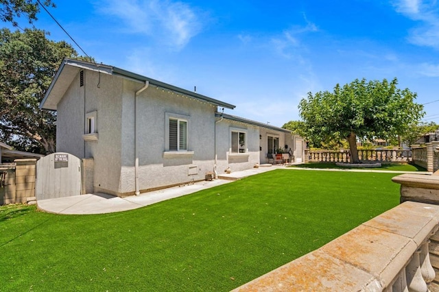 4624 Katherine Place, La Mesa, CA 91942 - back of house featuring stucco siding and a fenced backyard