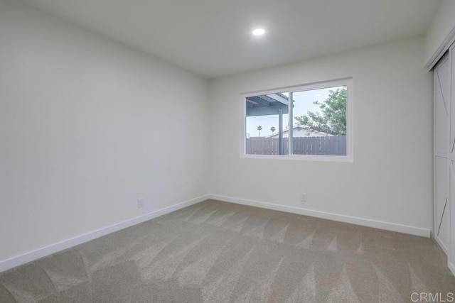 6947 Wallsey Dr, San Diego, CA 92119 - unfurnished bedroom featuring light colored carpet, recessed lighting, and a closet