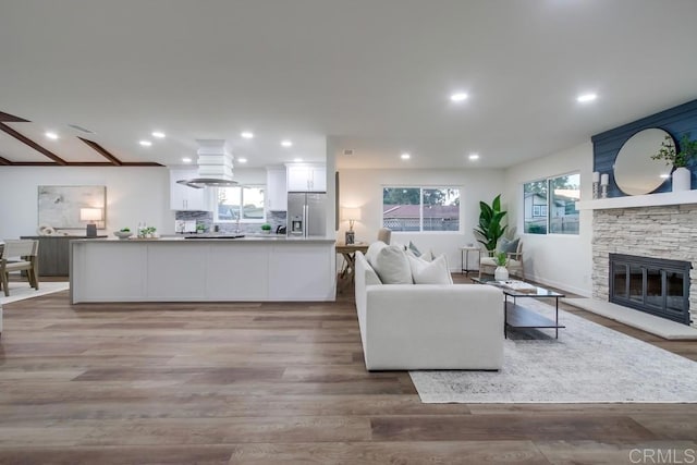 6947 Wallsey Dr, San Diego, CA 92119 - living area featuring a stone fireplace, wood finished floors, and recessed lighting