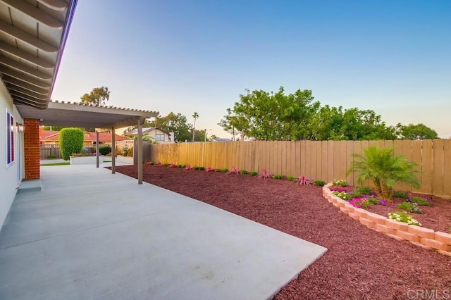 6947 Wallsey Dr, San Diego, CA 92119 - patio terrace at dusk featuring a patio area and a fenced backyard