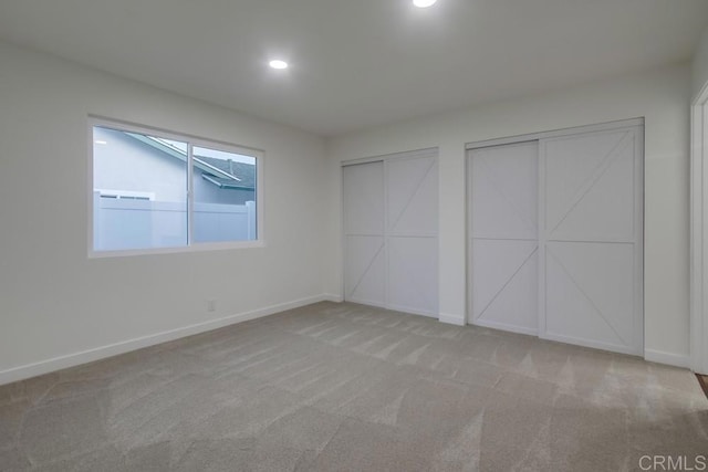 6947 Wallsey Dr, San Diego, CA 92119 - unfurnished bedroom featuring multiple closets, carpet flooring, and recessed lighting