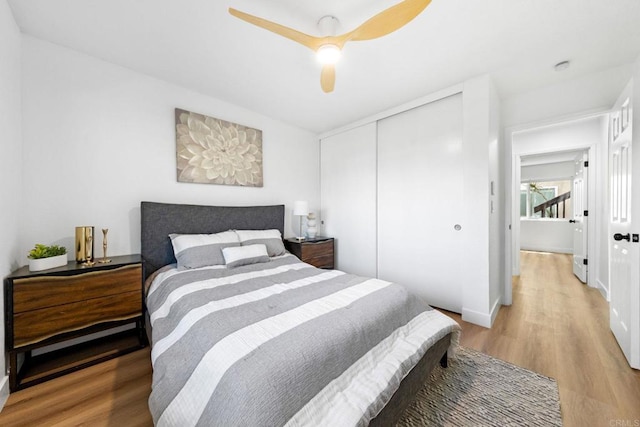 6735 Amherst St, San Diego, CA 92115 - bedroom with light wood finished floors, a closet, and ceiling fan