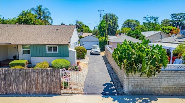 16918 Baltar St, Van Nuys, CA 91406 - view of front of home featuring a fenced front yard, board and batten siding, and a shingled roof