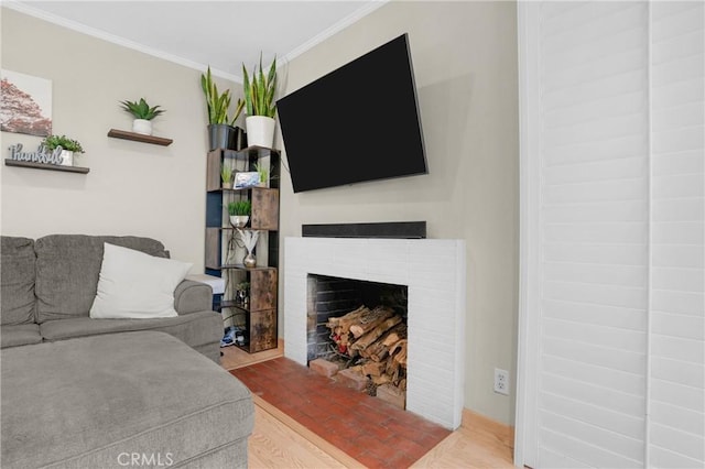 16918 Baltar St, Van Nuys, CA 91406 - living room with ornamental molding, a fireplace, and wood finished floors