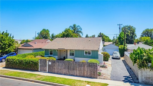 16918 Baltar St, Van Nuys, CA 91406 - view of front of home featuring a fenced front yard, roof with shingles, a gate, and a garage