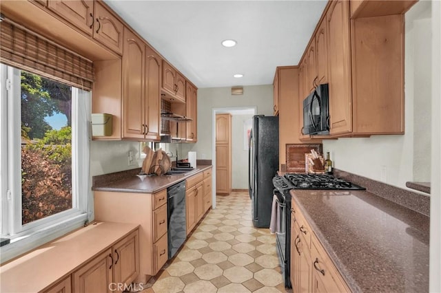 16918 Baltar St, Van Nuys, CA 91406 - kitchen featuring black appliances, light flooring, dark countertops, and recessed lighting