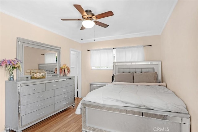 16918 Baltar St, Van Nuys, CA 91406 - bedroom featuring light wood-style floors, ornamental molding, and a ceiling fan