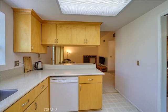 92 Mariposa Dr, San Luis Obispo, CA 93401 - kitchen with white dishwasher, a peninsula, and light countertops