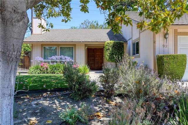92 Mariposa Dr, San Luis Obispo, CA 93401 - view of front facade with a shingled roof and a chimney