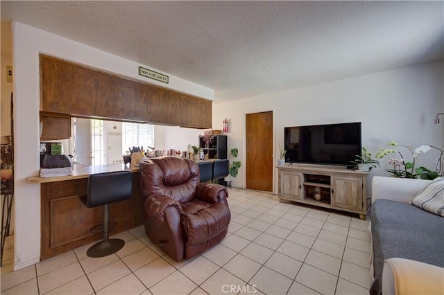 2130 Ocean St, Oceano, CA 93445 - living room featuring light tile patterned floors and a textured ceiling
