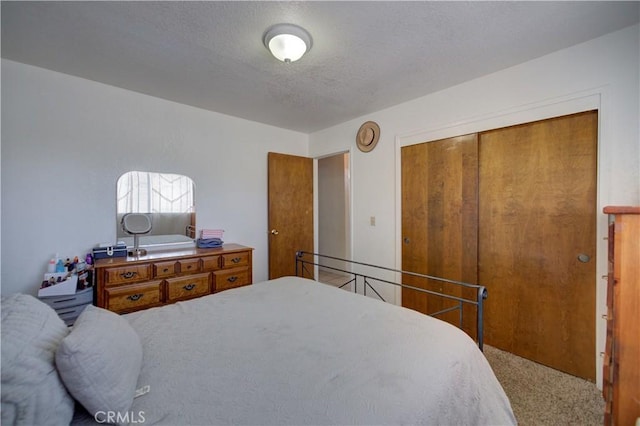 2120 Ocean St, Oceano, CA 93445 - bedroom featuring carpet floors, a closet, and a textured ceiling