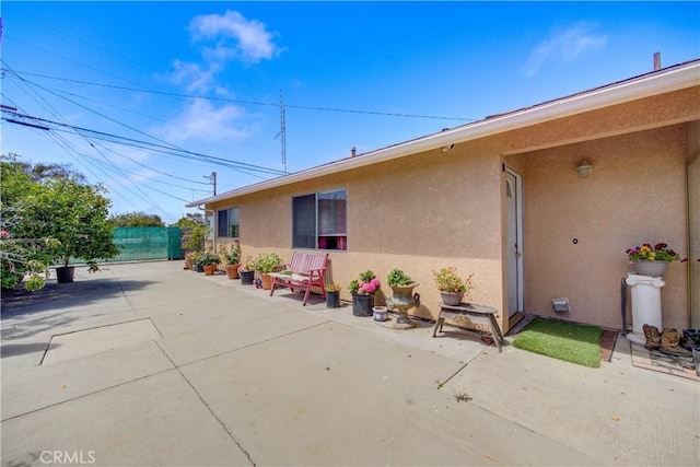 2120 Ocean St, Oceano, CA 93445 - view of home's exterior with stucco siding and a patio area
