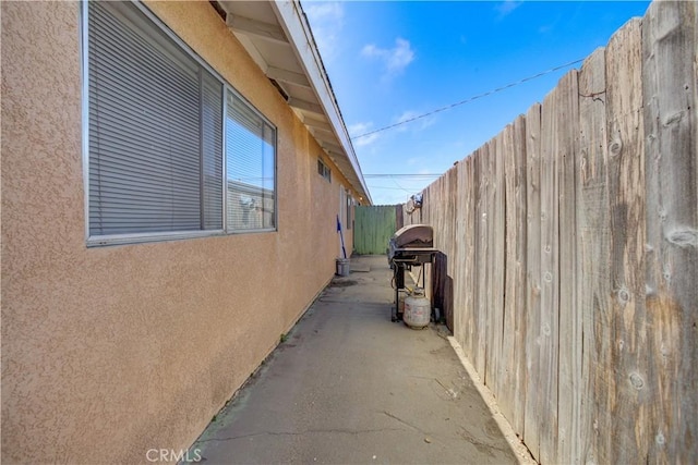2120 Ocean St, Oceano, CA 93445 - view of side of property with stucco siding and a patio