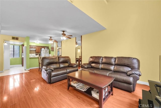 10642 Shoreline Dr Unit 80, Norwalk, CA 90650 - living area with ceiling fan and light wood-style flooring